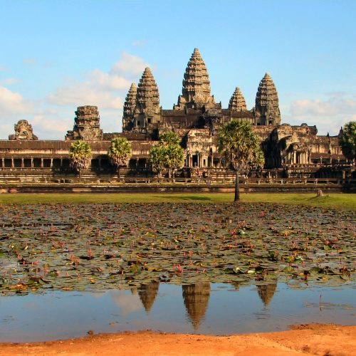 Angkor Wat temple towers reflected in the moat at sunrise, Siem Reap