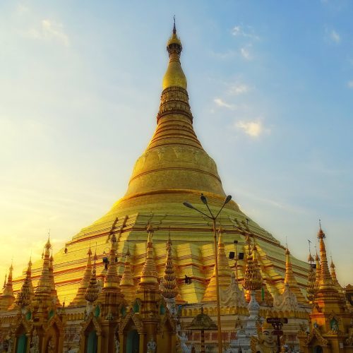 The gilded Shwedagon Pagoda glowing at dusk in Yangon, Myanmar