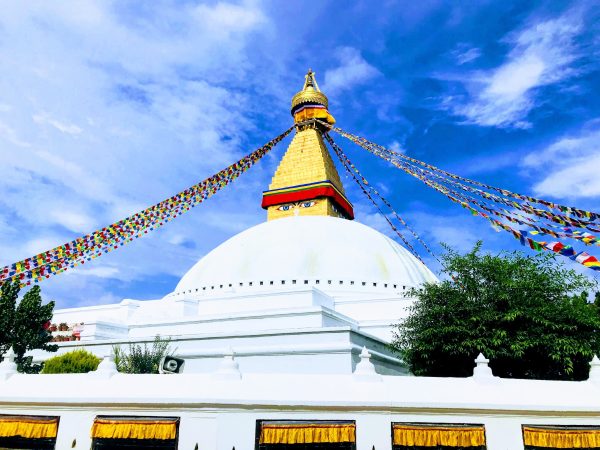 The white dome and golden spire of Boudhanath stupa in Kathmandu The white dome and golden spire of Boudhanath stupa in Kathmandu