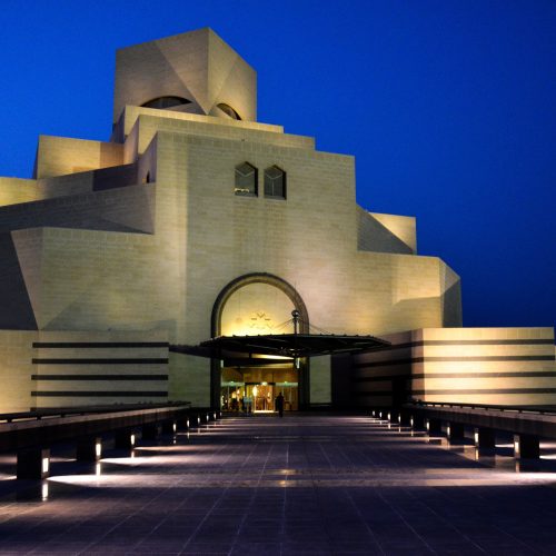 The Museum of Islamic Art beside the Doha waterfront skyline